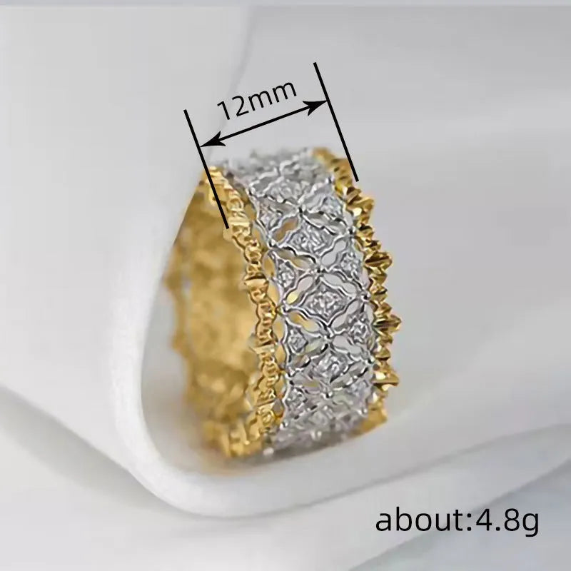 Geometric two-tone zircon ring with round elements on a copper base, shown in gold.