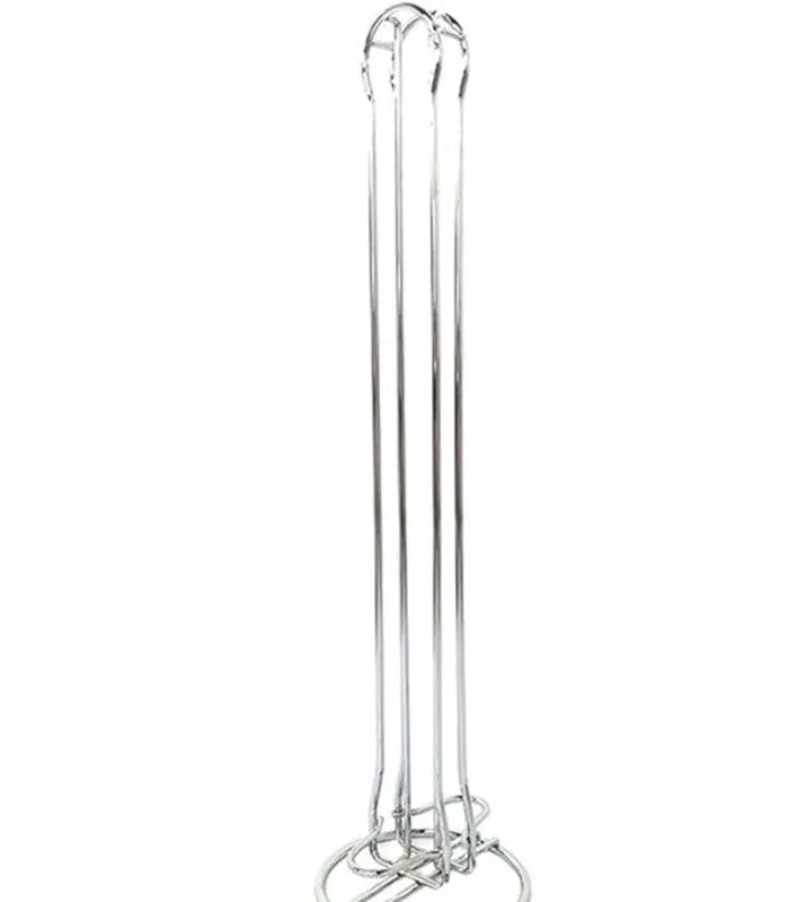 Black wrought iron coffee capsule storage rack holding twenty pods on display shelves.