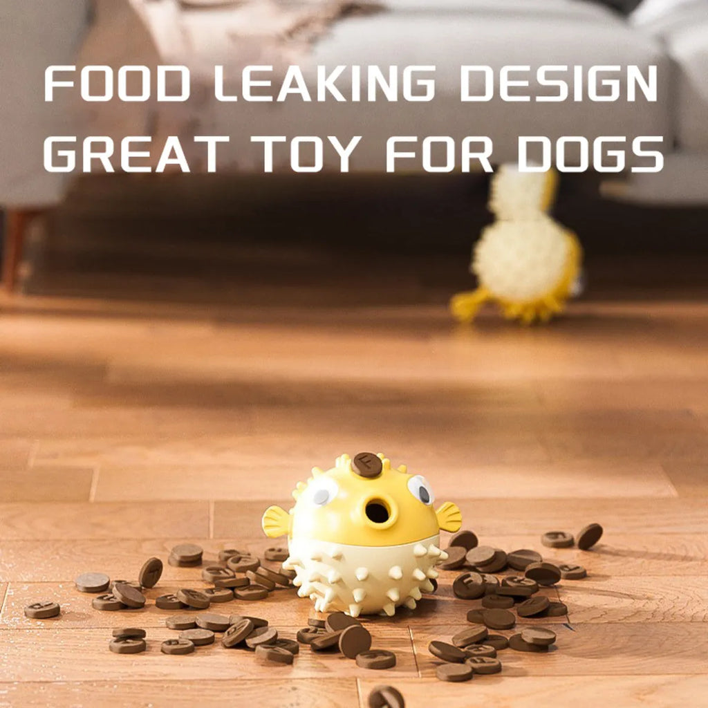 Yellow fish-shaped vinyl dog chew toy with textured surface and squeaker