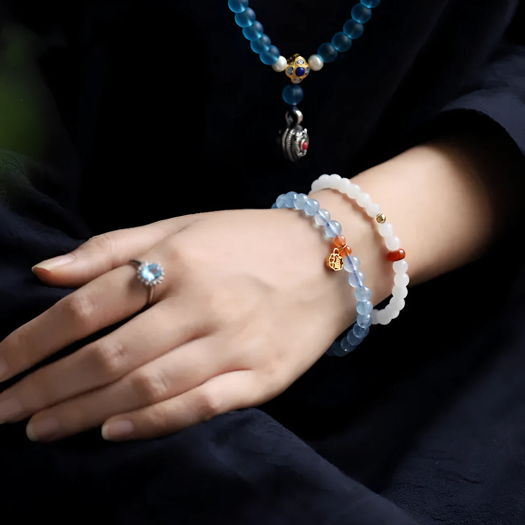 Natural aquamarine crystal blessing card bracelet with icy translucent 8mm round beads and sequin accents.