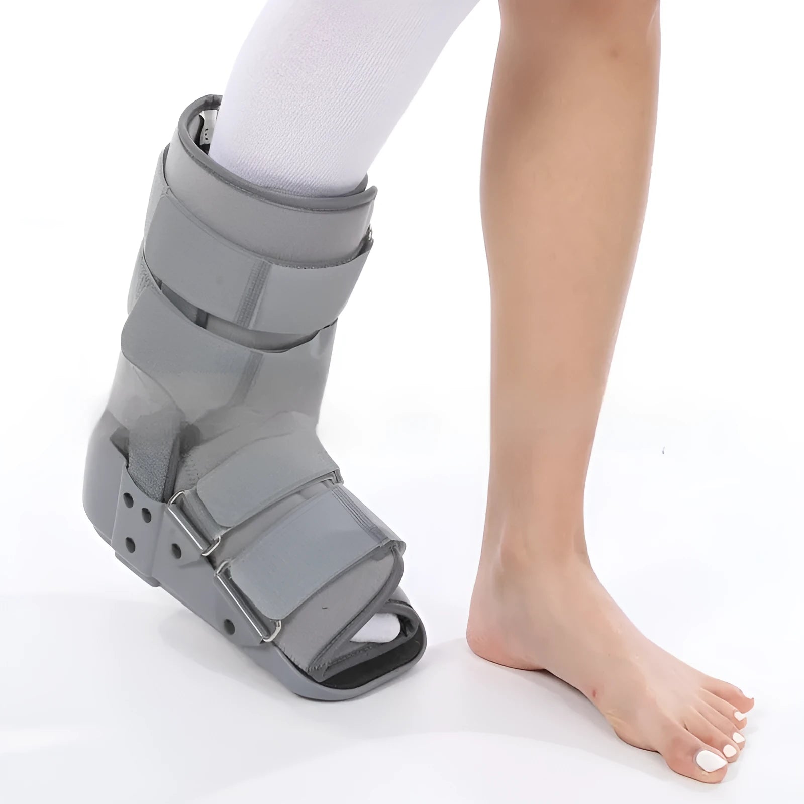 Grey and black Achilles tendon rehabilitation boot with plastic shell, aluminium struts, and adjustable nylon straps.