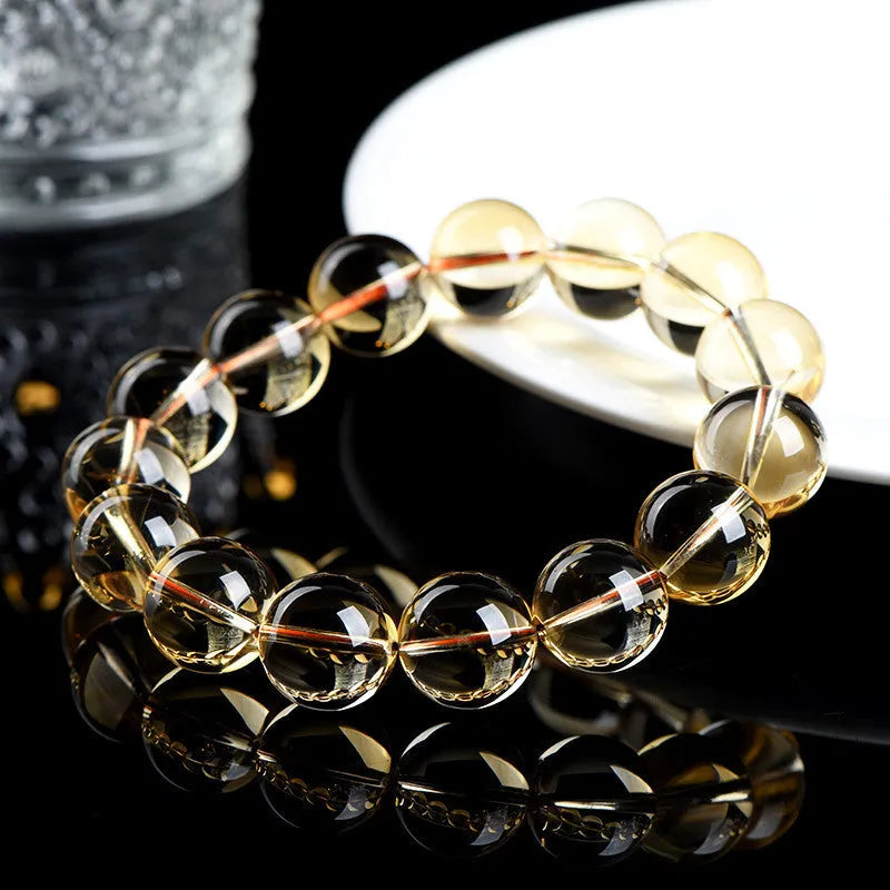 Natural citrine scattered beads ball bracelet showing 7A and 6A colour grade options on a wrist.