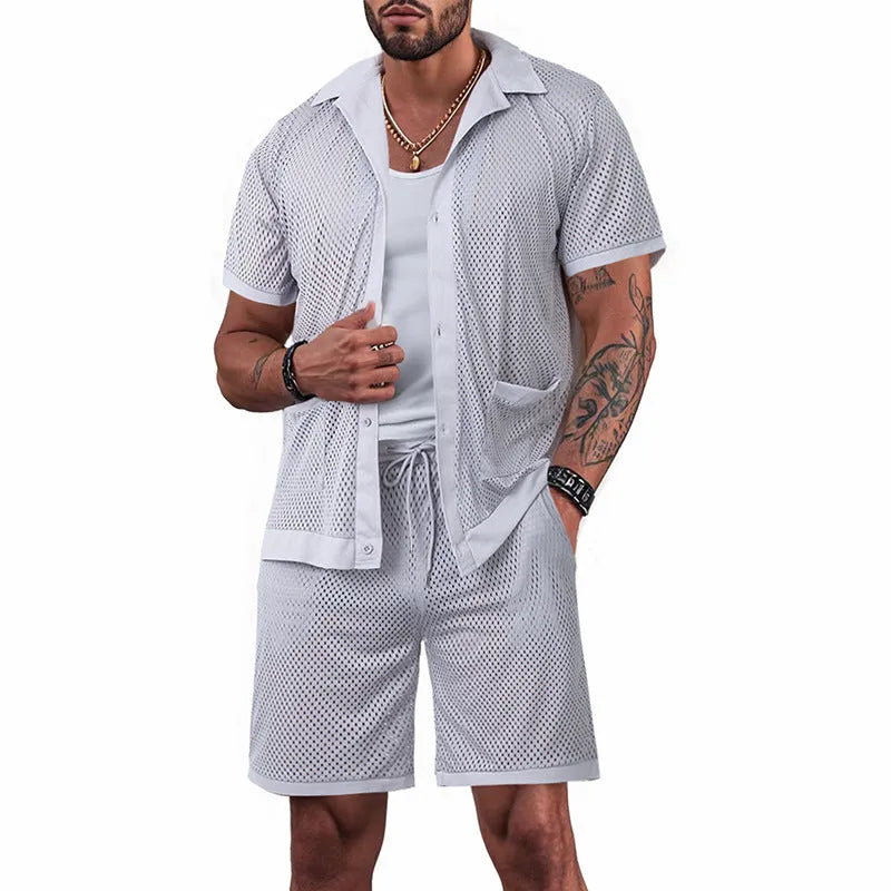 Hawaiian-style beach co-ord set with a white mesh dress over a light grey cardigan and shorts on a mannequin.