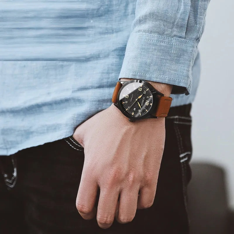 Men's retro automatic mechanical watch with black case and leather strap showing dial detail