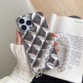 Gold and silver luxury iPhone cases with attached chain and diamond lock bracelet.