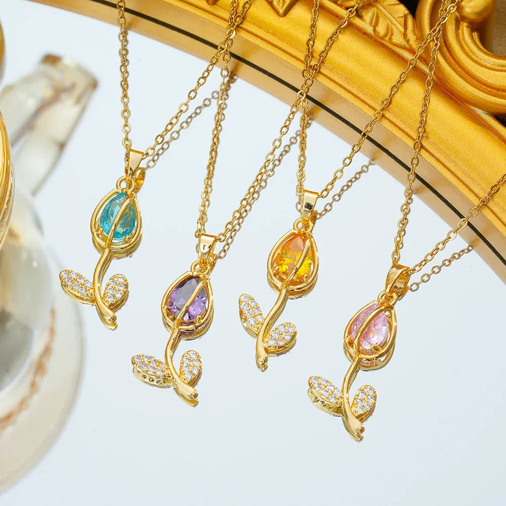 Zircon tulip necklace for women in gold colour on adjustable O-ring chain, showing floral pendant shape.