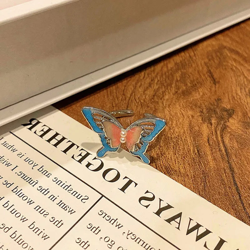 Butterfly women's copper ring with adjustable split ring design showing oil-drip colour treatment