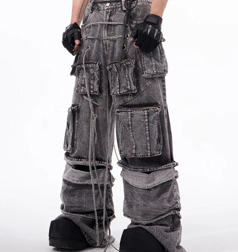 Grey distressed denim overalls with rope stitching and mop pant design on male model