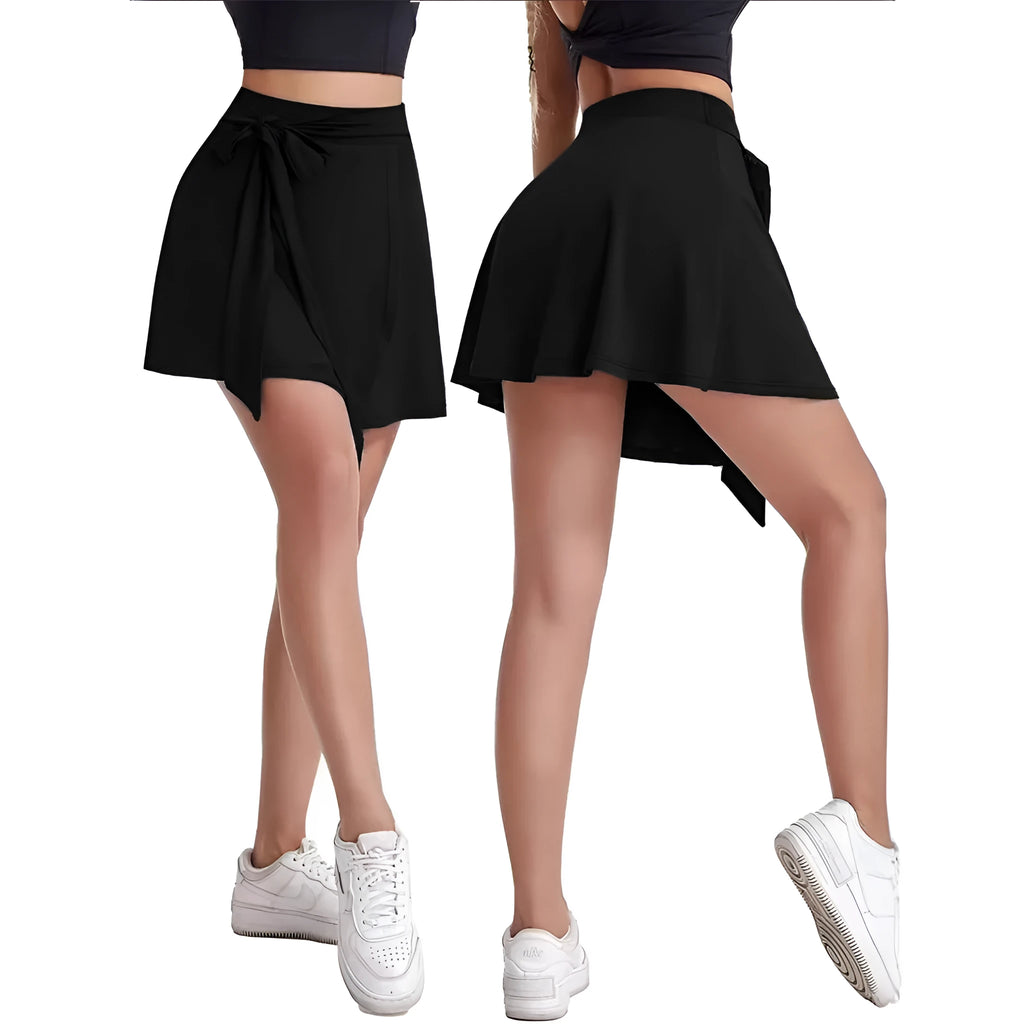 Black thigh-length high-waisted sports culottes with shoulder straps and integrated shorts.