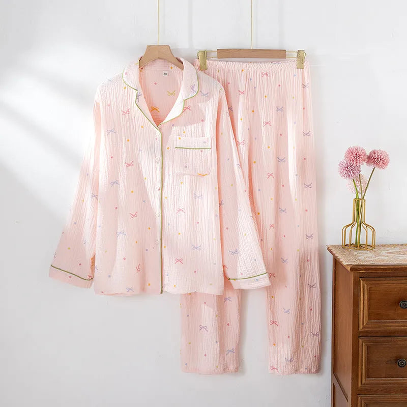 Women's beige cotton pajama set with long sleeves and full-length trousers for home lounging.