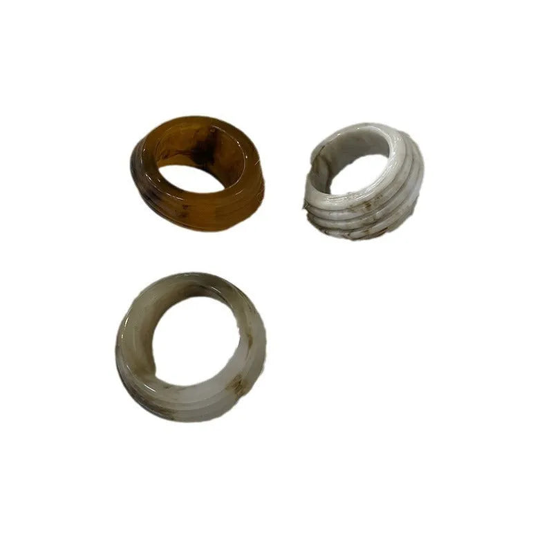 Geometric irregular resin ring in free size, shown in Maillard brown colour.