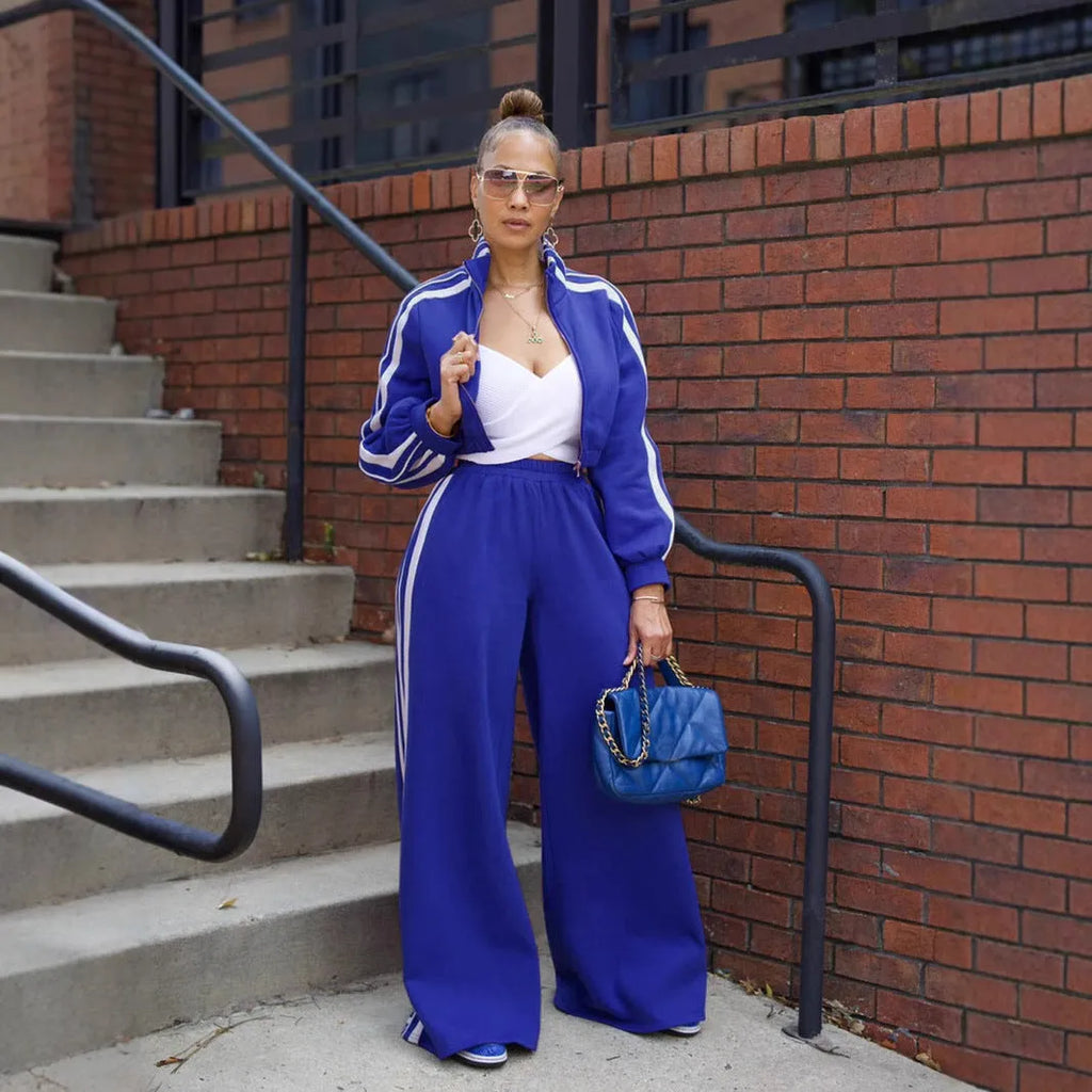 Grey striped sweater with zipper and matching trousers, a street hipster two-piece set.