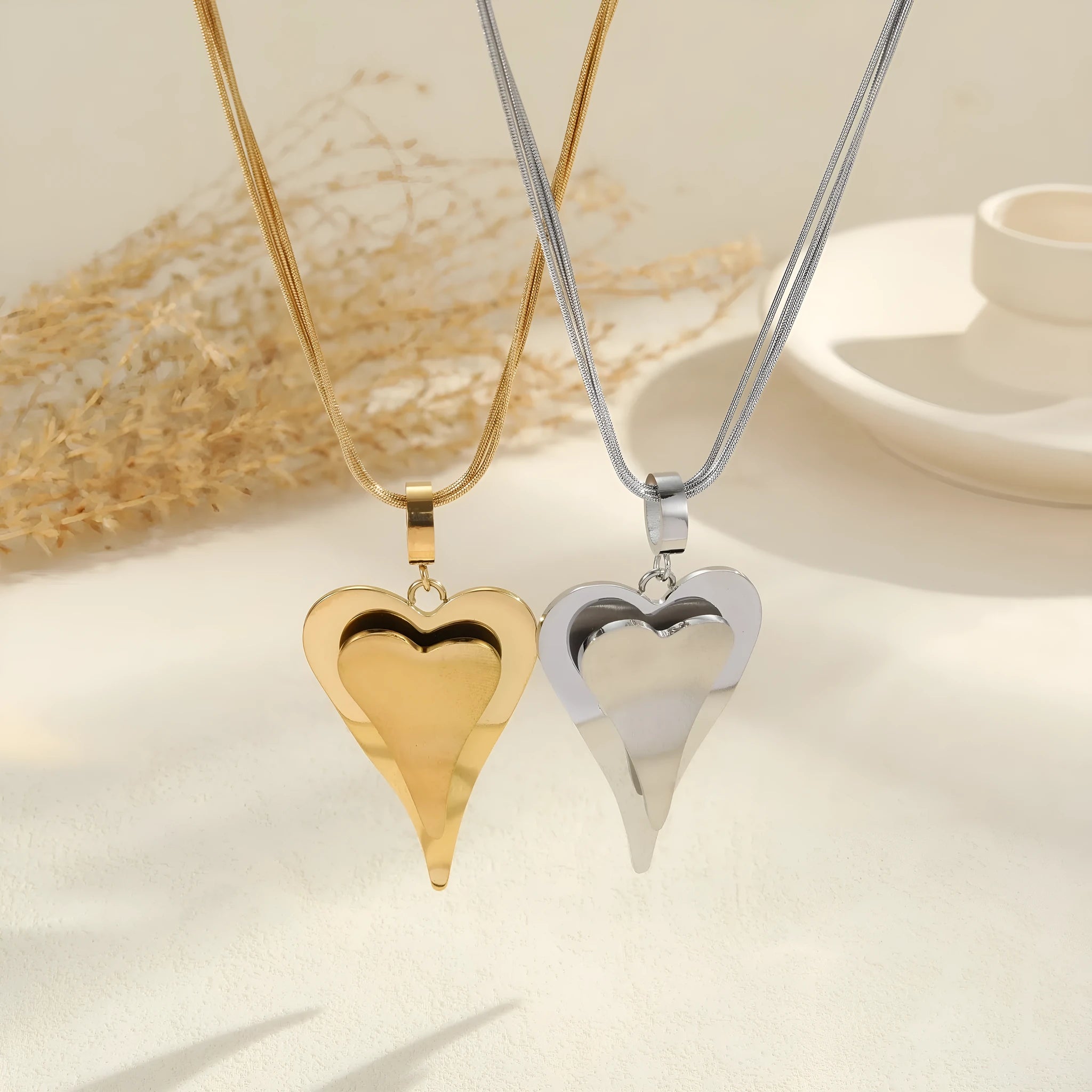 Double heart snake bones geometric necklace in gold and steel stainless steel finishes