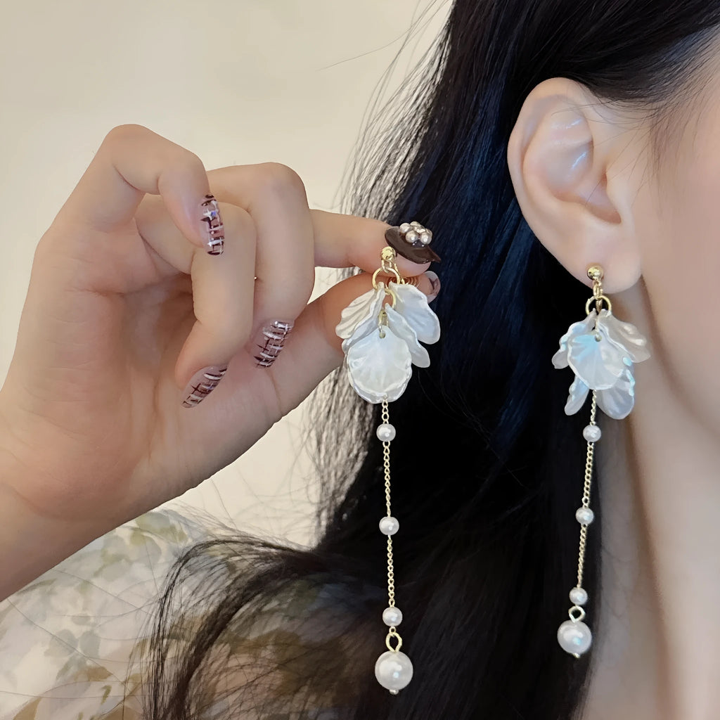 Women's acrylic shell pearl tassel earrings showing 8.8cm length with multiple clip style options
