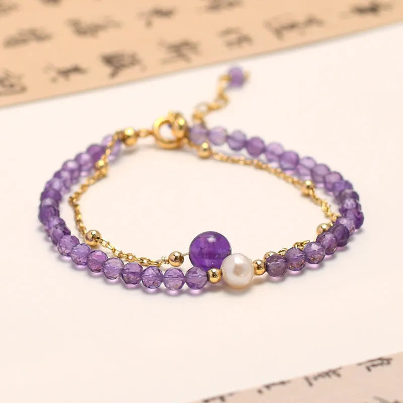 Chinese style women's crystal bracelet with amethyst coloured simulated diamond stones