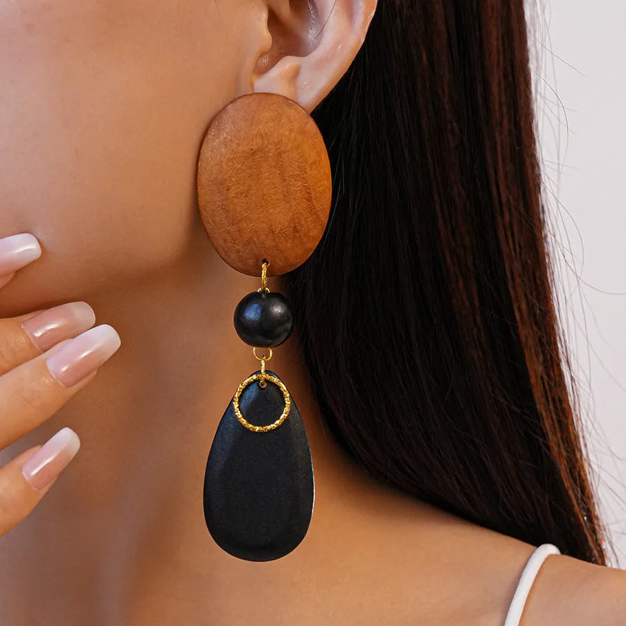 Handmade wooden ellipse earrings in silver needle brown black colour, retro fashion style.