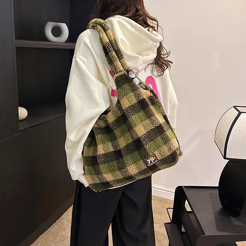 Women's soft plush plaid crossbody tote bag showing large capacity and zipper pocket in horizontal square design.