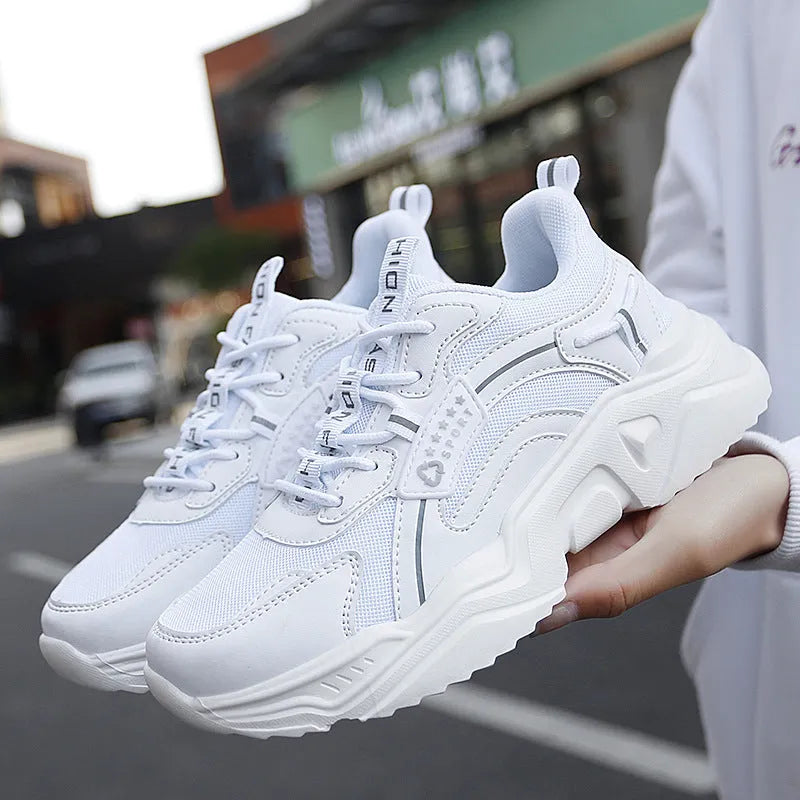 Women's white casual sports shoes with thick sole, mesh upper, buckle detail and round toe