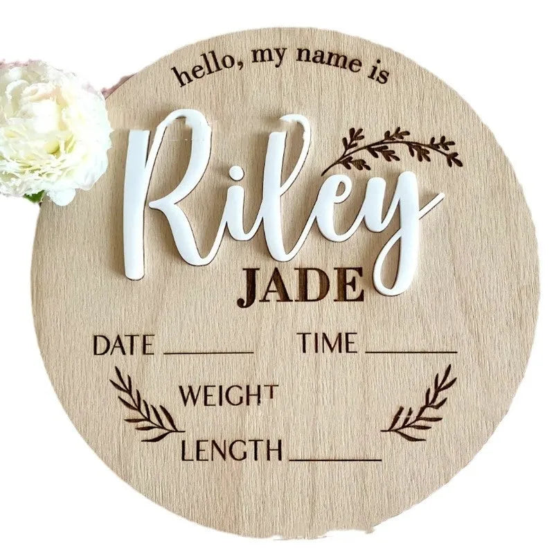 Square wooden baby name sign with engraved birth details including name, date, time, weight, and length.