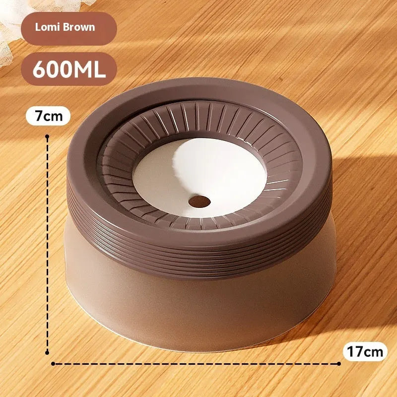 Green raised pet suspension bowl for dogs and cats on a white plate.