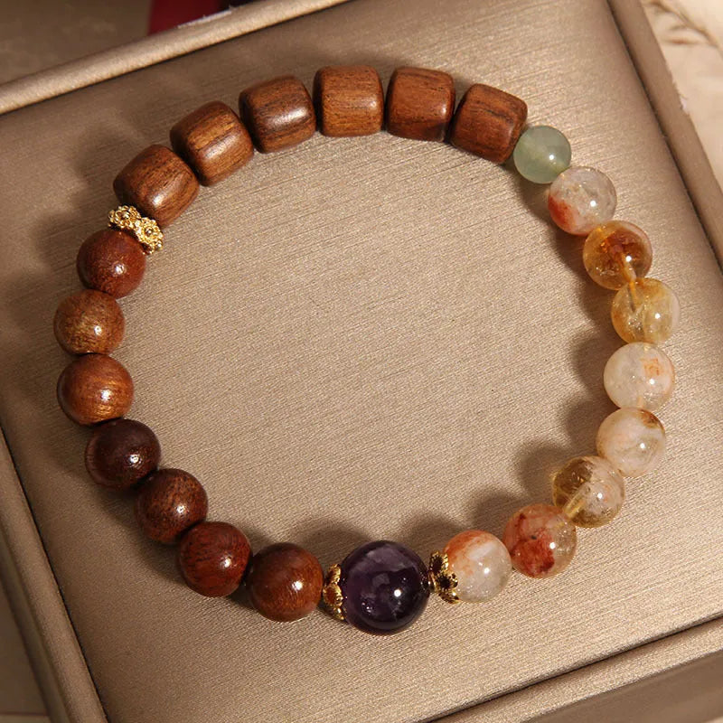 Women's crystal bracelet with yellow tower crystal and ebony amethyst beads featuring pearl and rhinestone accents