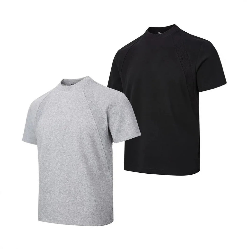 Man wearing a loose-fit black short-sleeve polyester top with air layer stitching.