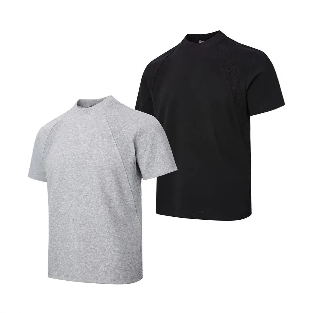 Man wearing a loose-fit black short-sleeve polyester top with air layer stitching.