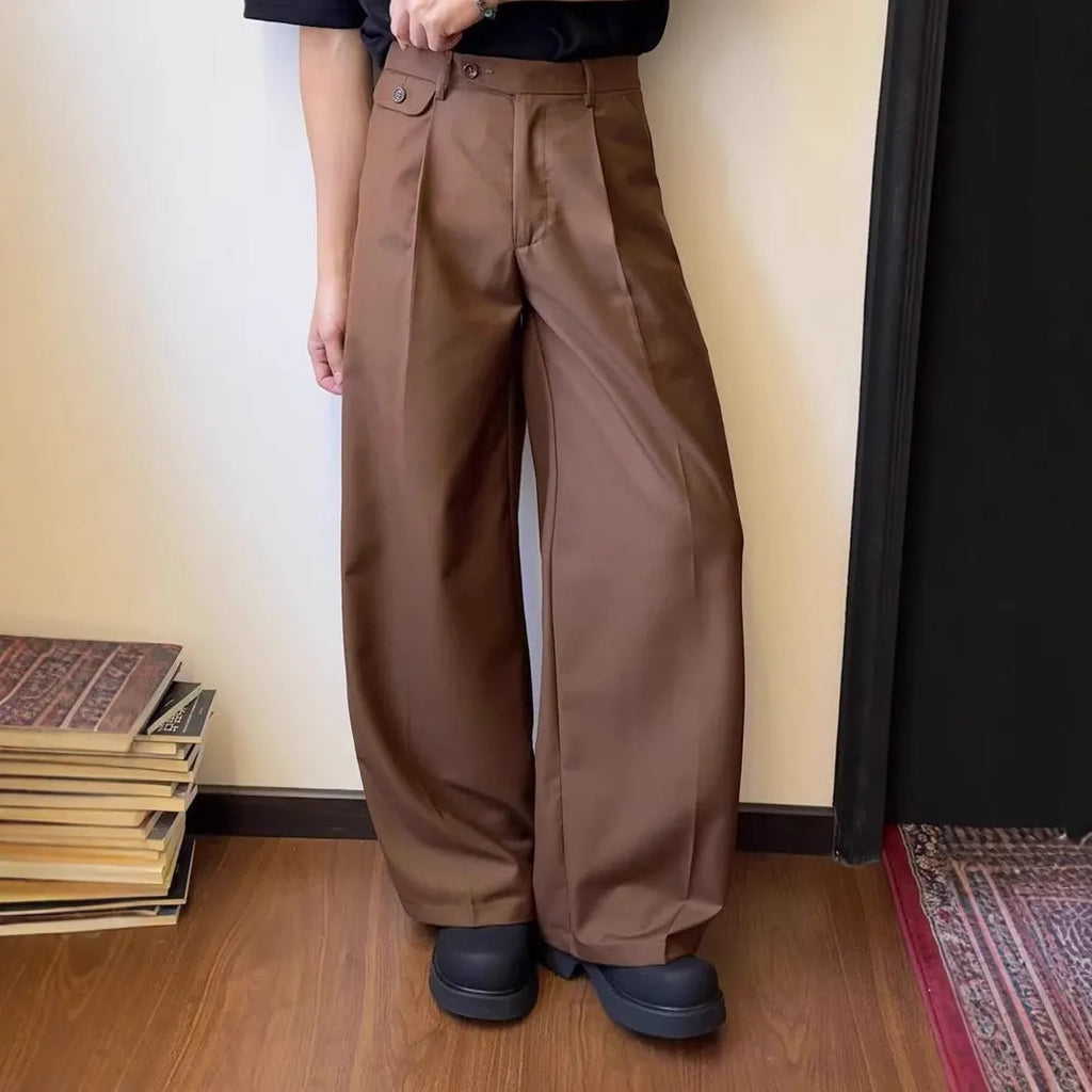 Brown men's straight-leg loose-fit suit trousers laid flat, showing wide-leg drape style.