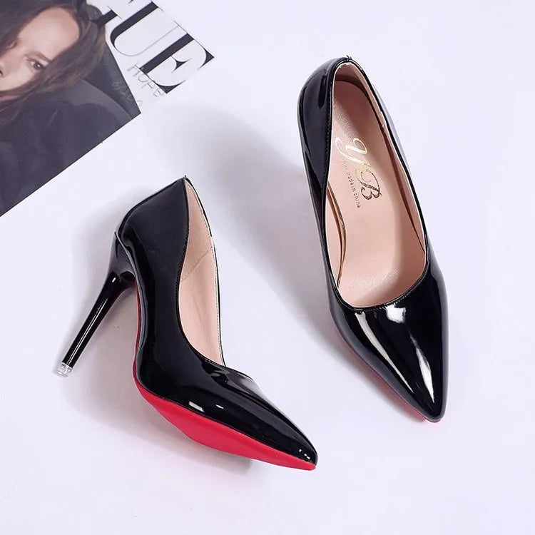 Women's black stiletto heel pointed toe pumps with a shallow mouth on a white background.