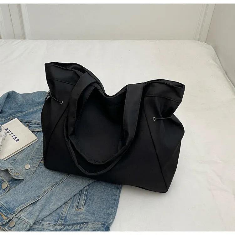 Soft foldable Oxford cloth commuter shoulder tote bag in street trend style.