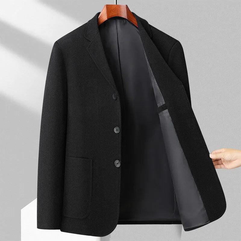 Loose-fit men's woolen coat in black, shown on a model for casual spring or autumn wear.