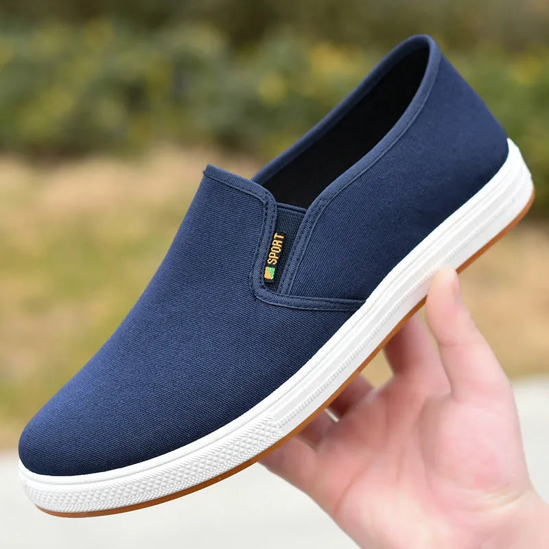 Men's black canvas slip-on shoes with round toe and shallow mouth design