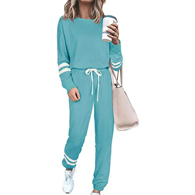 Women's plus size loose-fitting casual suit set in a solid colour, showing the long-sleeve top and matching trousers.