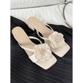 Women's fashion sandals with a chunky heel, square toe, and one-strap satin upper in cream-white colour.