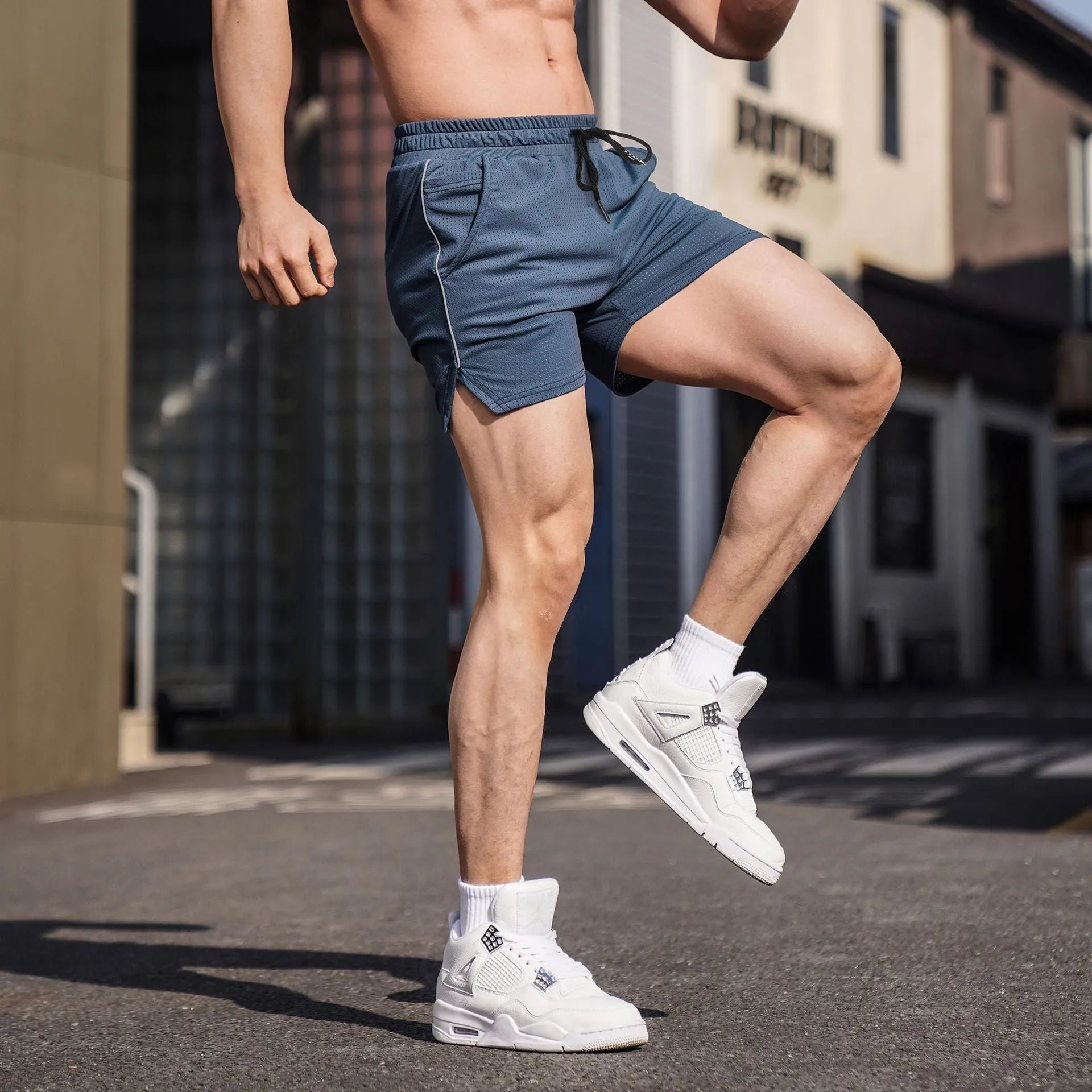 Men's straight leg polyester sports shorts in black, grey, navy, or red.