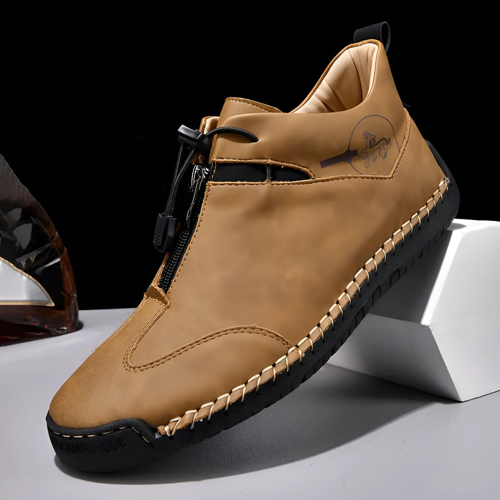 Men's black casual leather shoes with a mid-heel and rounded toe on a neutral background