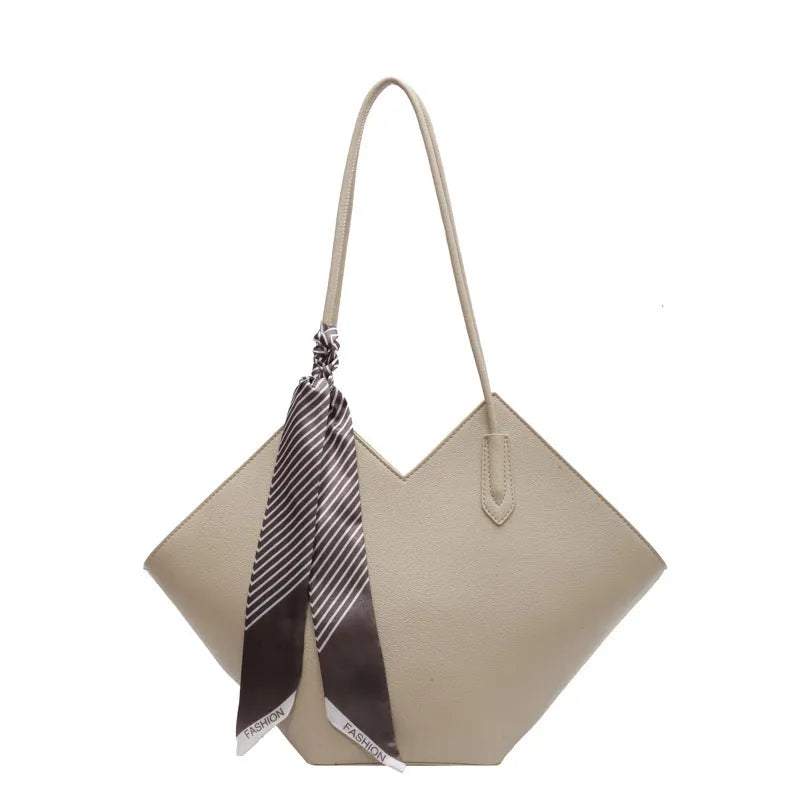 Women's large black PU leather shoulder bag with square shape showing exterior pocket and adjustable handle