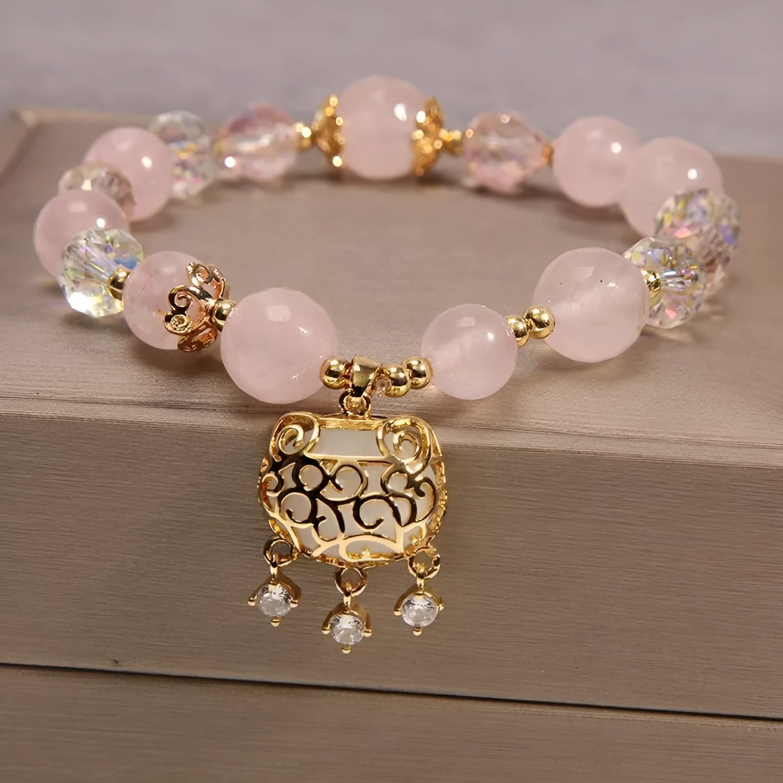 Women's yellow agate crystal beaded bracelet with gold silk thread and tassel.