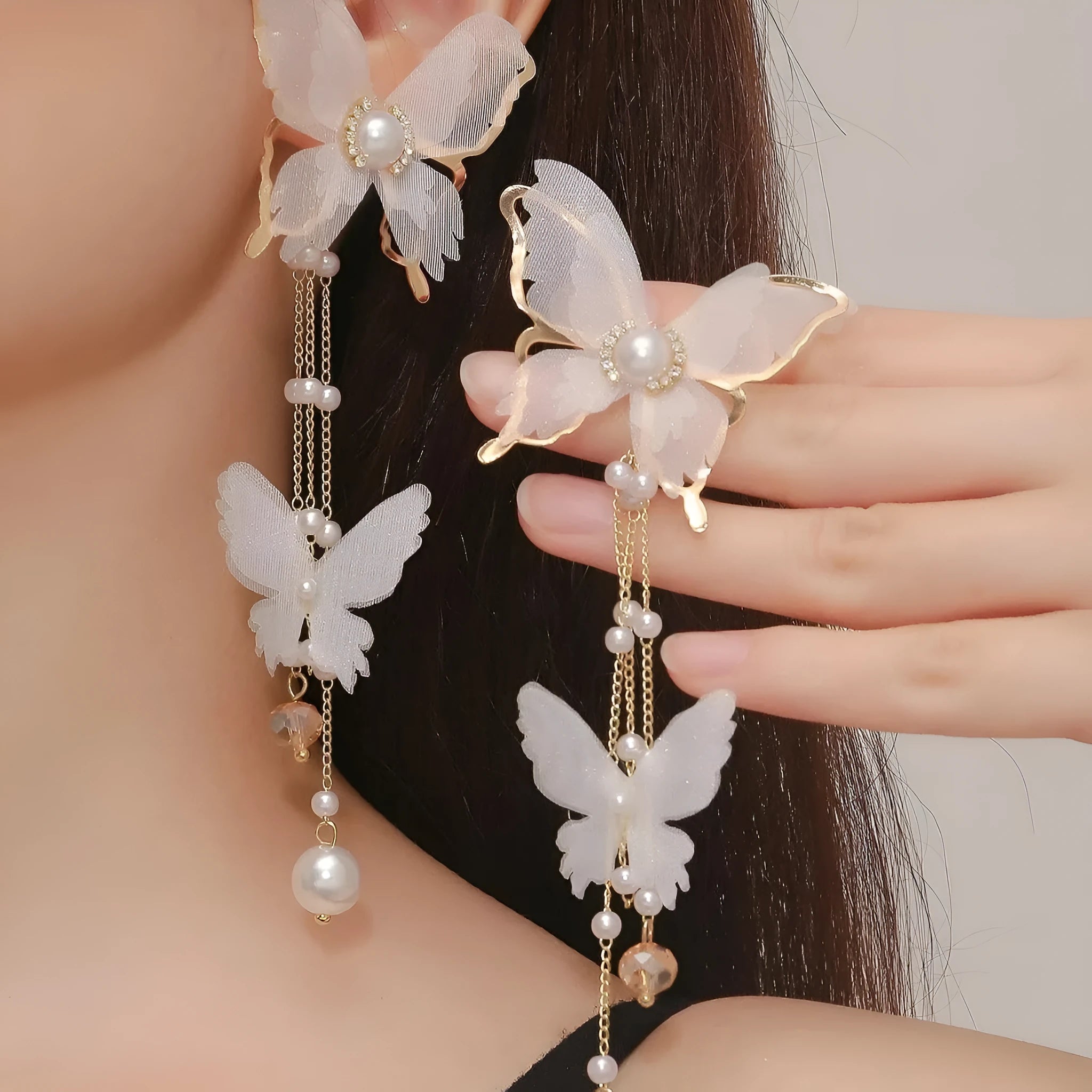 White butterfly earrings with tassel lace and pearl rhinestone decorative details