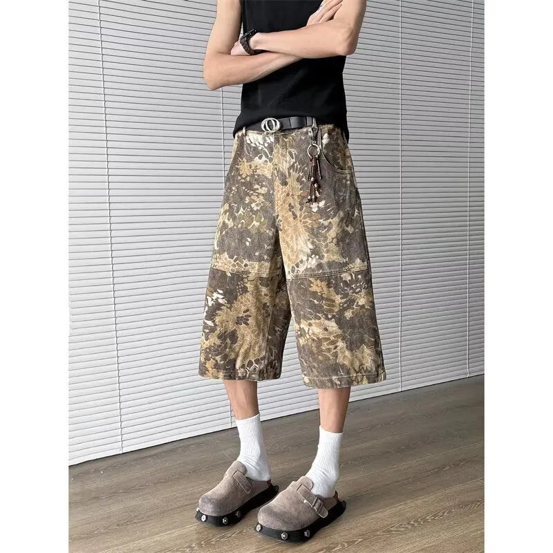 Yellow women's jeans with snake camouflage print, cropped length, and high waist.