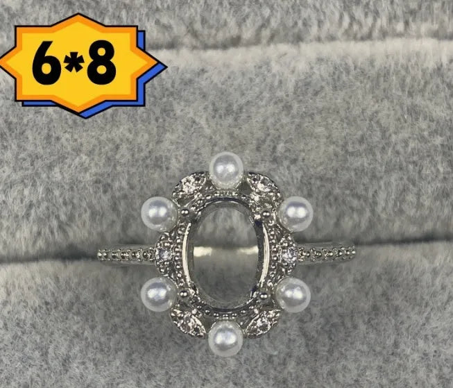 Oval denier ring with 6x8mm stone, open mouth design, and five-pointed star detail