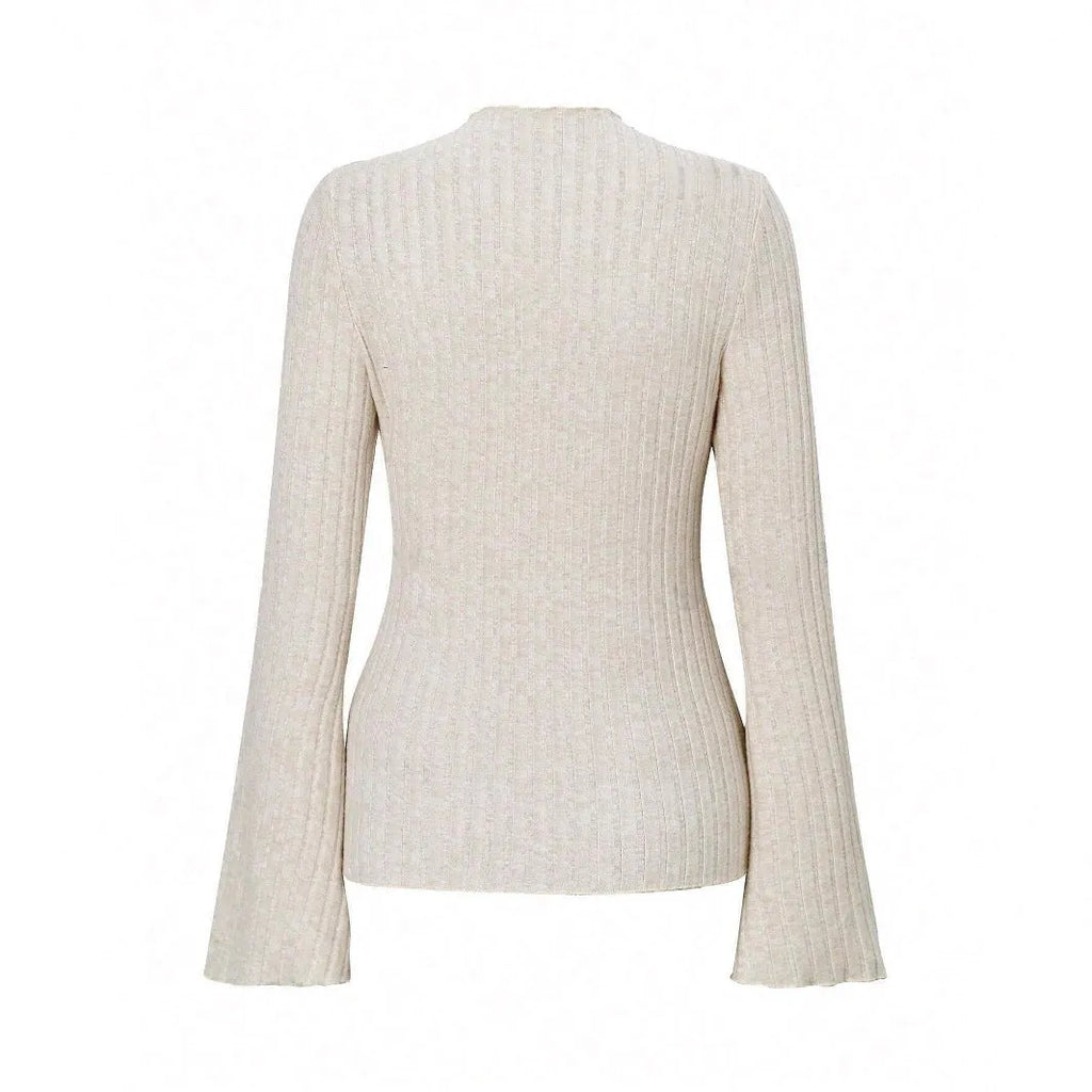 Man wearing a slim-fit long sleeve black top with a subtle brushed stripe texture and round neck.