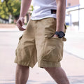 Man wearing loose-fit army green cotton blend shorts, showcasing the retro summer workwear style.