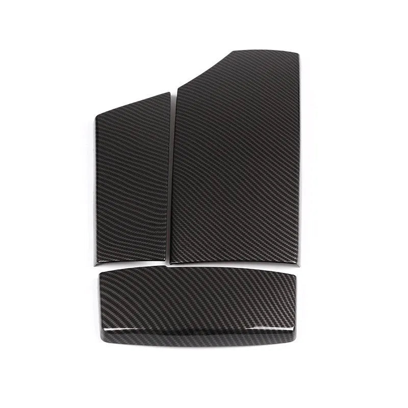 Three ABS plastic armrest box covers with a shiny carbon fibre pattern, shown next to a car centre console.