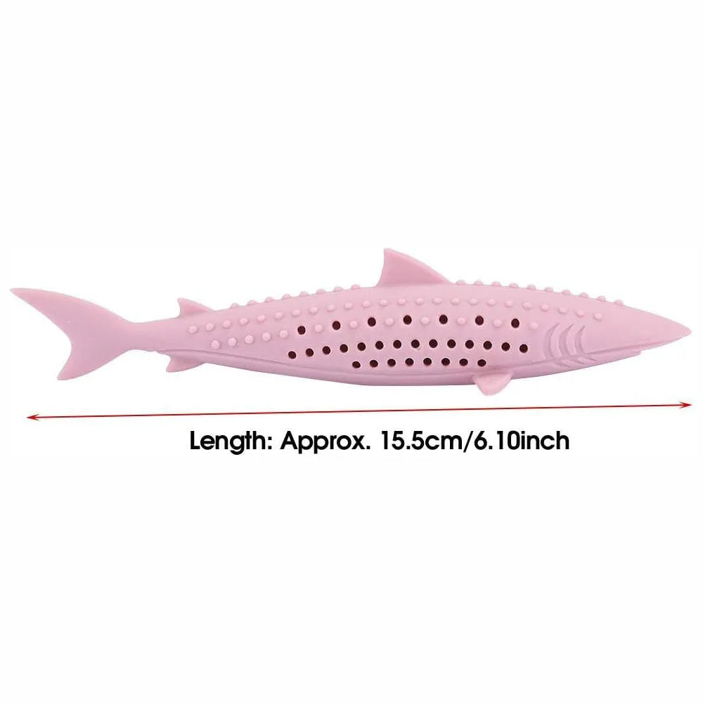 Green fish-shaped silicone chew toy for cats with visible side holes and a removable section for catnip.