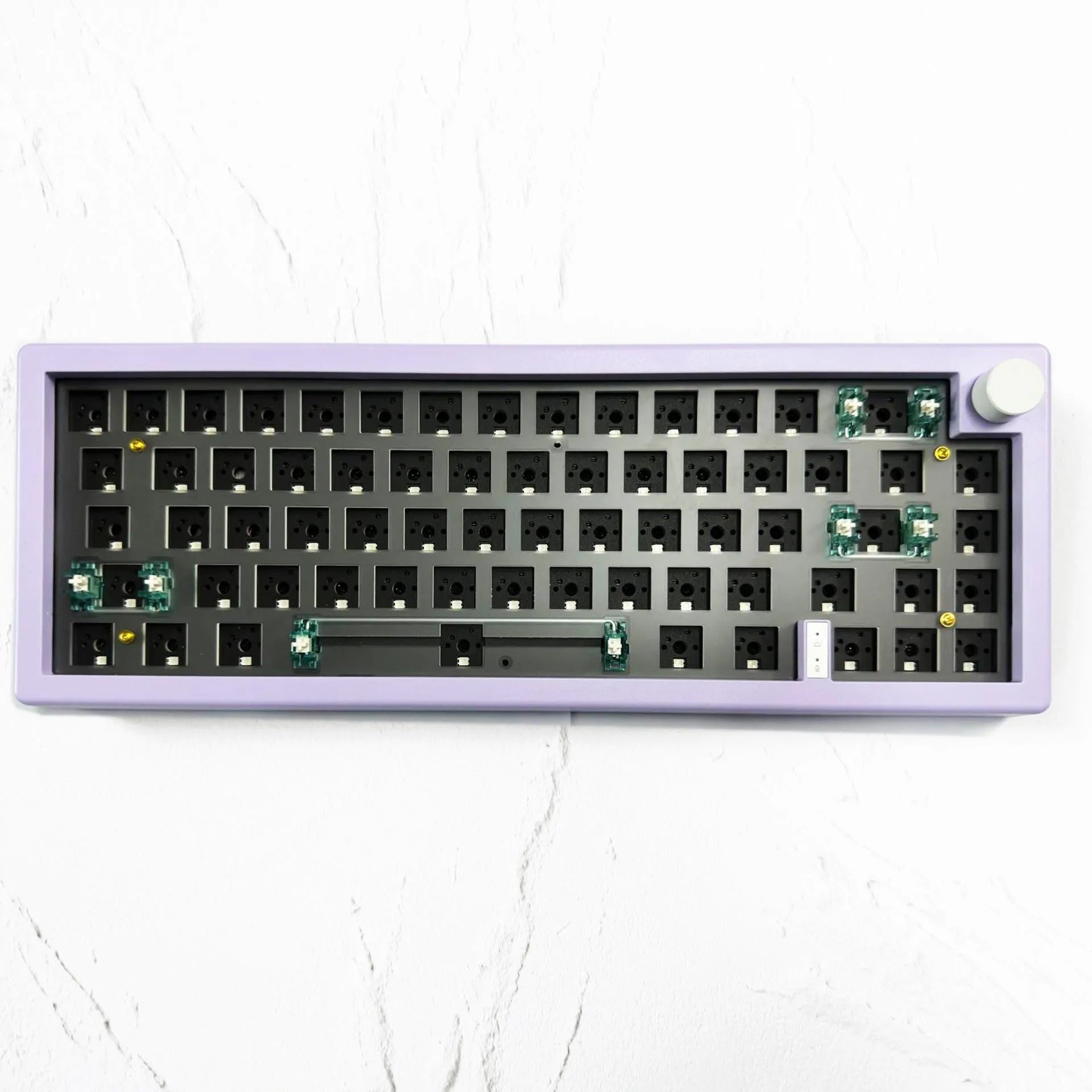 DIY hot-swappable RGB mechanical keyboard kit with ABS chassis, rotary knob, and USB cable in multiple colours.