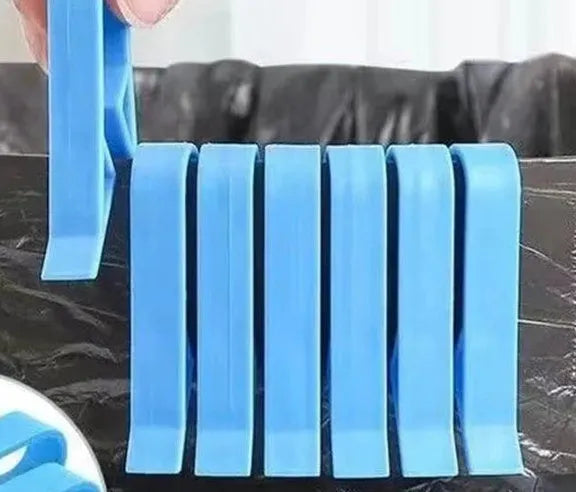 Non-slip plastic fixing clip for holding rubbish bags onto the side of a bin.