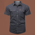 Men's short sleeve cotton work shirt in loose fit cardigan style showing non-ironing construction