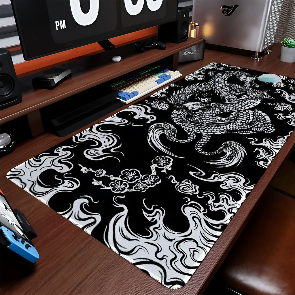 Creative dragon design gaming mouse pad on a desk, showing cloth surface and non-slip base.