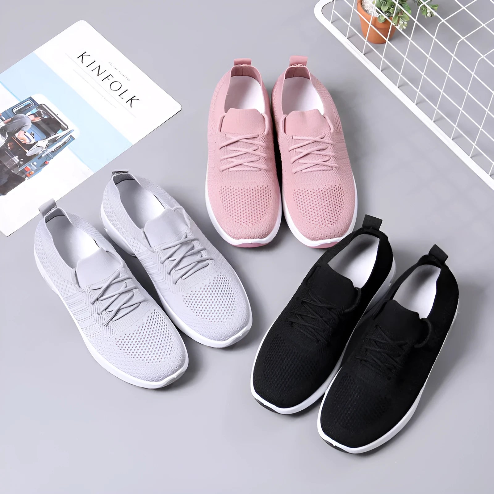 Women's black mesh sneakers with a round toe, front lace-up, and soft PVC sole.